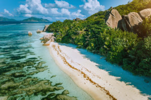 Seychelles, La Digue. Aerial view of beautiful paradise tropical beach Anse Source d'Argent in morning soft light. Summer vacation and travel concept. Seychelles, La Digue. Aerial view of beautiful paradise tropical beach Anse Source d'Argent in morning soft light. Summer vacation and travel concept.